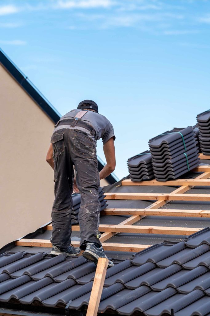 construction worker installs a fired ceramic tile 2023 11 27 05 34 10 utc