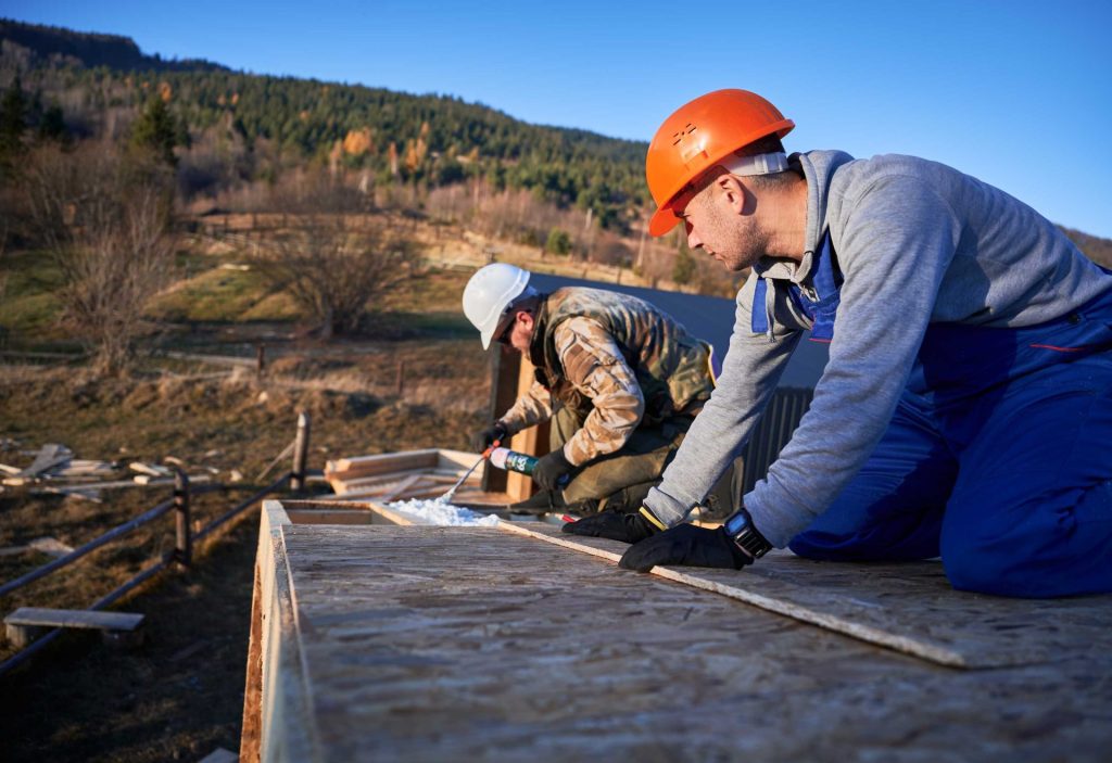 male builder doing thermal insulation on roof of w 2023 11 27 05 12 29 utc